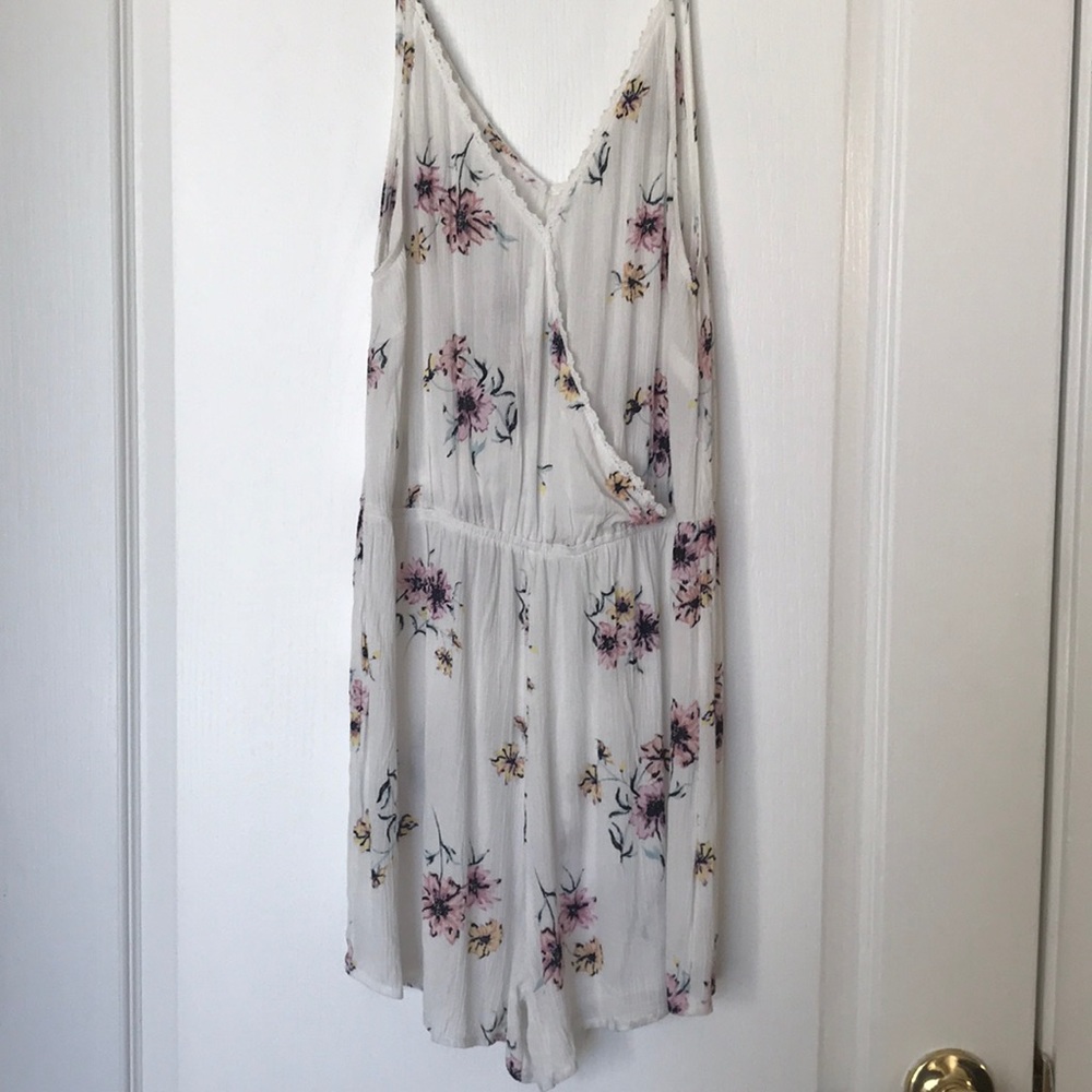 A new floral romper size medium from PacSun